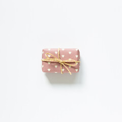 Heart pattern pink gift box isolated on white background. top view, copy space