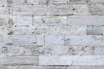 Ancient stone wall background close-up. Part of fortifications.