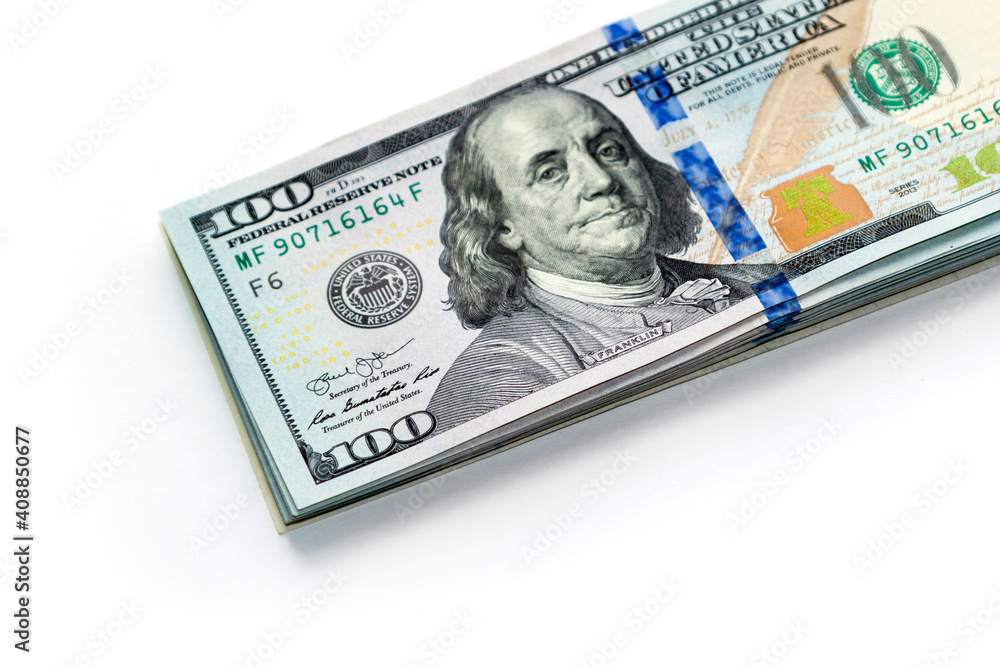 Wall mural stack of new design one hundred us dollar bills isolated on white background