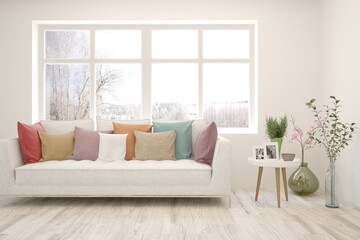 White living room with sofa and winter landscape in window. Scandinavian interior design. 3D illustration