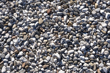 background of small stones of various shapes. gravel