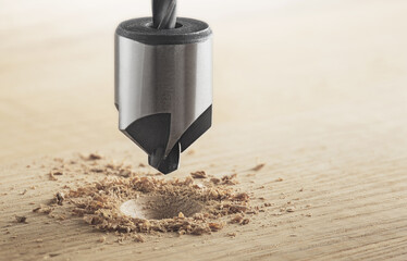 Countersink drill bit make sink in hole for screw in wooden oak plank
