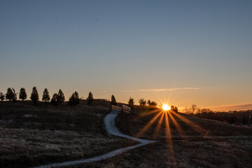 sunrise over park with path