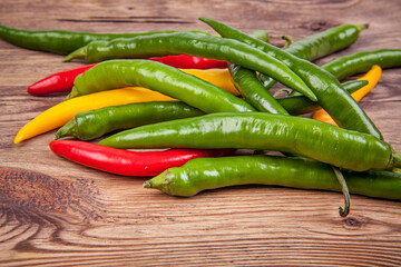 Small peppers on a wooden background. View from another angle in the portfolio.