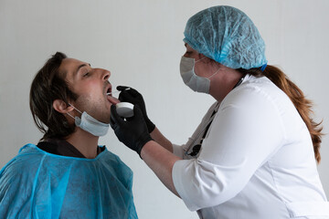 Medic taking sample for coronavirus testing. Horizontal composition