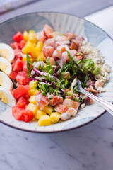 Cobb salad. Classic American restaurant or French bistro Cobb salad, made with chopped Bibb or Romain lettuce, heirloom tomatoes, bacon, blue cheese, avocado, hard boiled eggs tossed with olive oil.