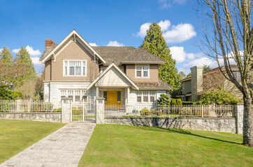 Houses in suburb with Spring Blossom in the north America. Luxury houses with nice white and pink...