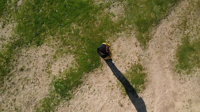 Man seen from drone standing in nature