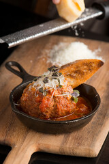 Meatballs. Classic Italian or Greek restaurant favorite. Ground meat mixed with onions, garlic, herbs, eggs, bread crumbs, spices, fried. and sautéed in homemade marinara sauce and cheese.