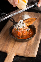 Meatballs. Classic Italian or Greek restaurant favorite. Ground meat mixed with onions, garlic, herbs, eggs, bread crumbs, spices, fried. and sautéed in homemade marinara sauce and cheese.