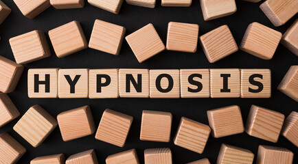 Word HYPNOSIS made with wood building blocks