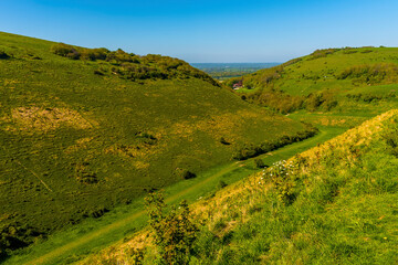 A view across the lower reaches of the longest dry valley in the UK on the South Downs near...