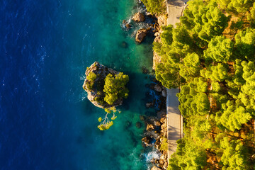 Croatia. Aerial view on rocks and forest. Vacation and adventure. Rocks and turquoise water. Top view from drone at beach and blue sea. Landscape from air. Travel image.