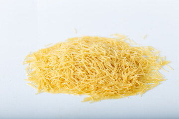 Uncooked vermicelli pasta isolated on white background