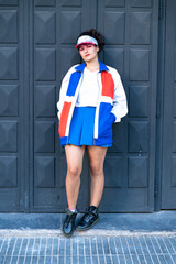 Young woman wearing retro sporty outfits