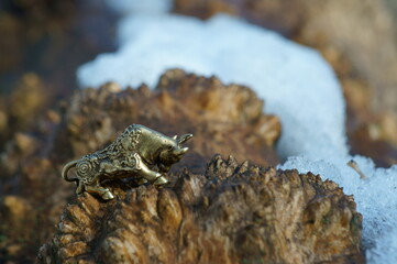 Metal bull figurine close-up. The symbol of 2021.