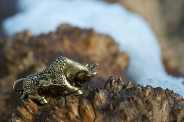 Metal bull figurine close-up. The symbol of 2021.