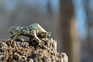Metal bull figurine close-up. The symbol of 2021.