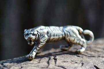 Metal tiger figurine close-up. Figurines close-up.