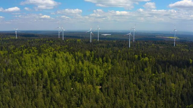 Aerial view of Wind Turbines in the black forest in Germany on a sunny day in summer.