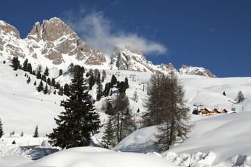 Beautiful snowy winter landscape at the San Pellegrino Pass in Val di Fiemme. South Tirol in Italy.