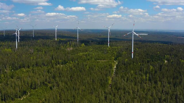 Aerial view of Wind Turbines in the black forest in Germany on a sunny day in summer.