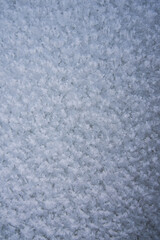 Background, texture of fresh fallen snow. Snowflakes close-up. The winter time of year