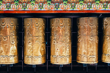 Buddhist prayer drums in Dharamsala, Om Mani Padme Hum - obrazy, fototapety, plakaty