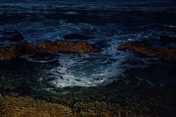  Waves on the Rocks at Night