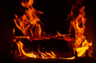 Flame of fire from burning coals in the bonfire