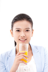 Oriental fashion woman drinking orange juice
