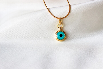 Close up of an evil eye bead necklace isolated on white background. Evil eye bead.
