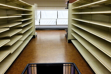 Empty shelves in a grocery store during the covid-19 crisis.