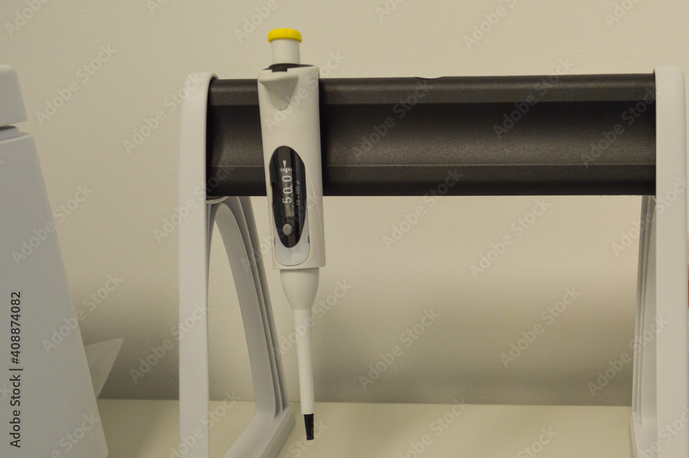 Poster pipette dispenser for laboratory diagnostics. single-channel pipette dispenser with sensitive tip an