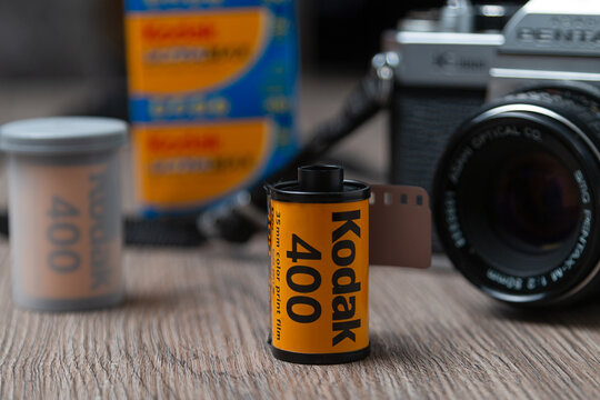 A roll of Kodak ultramax 400 35mm film  on a wooden table. Photo film concept: Latvia, Riga, January 26, 2021