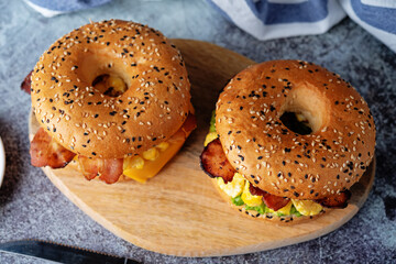 Fried bacon avocado cheese egg salad  bagel