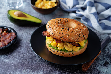 Fried bacon avocado cheese egg salad  bagel