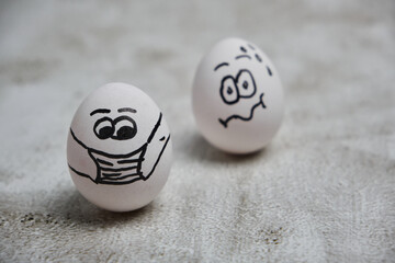 easter eggs with painted funny faces wearing mask for Easter holidays