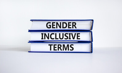 Gender inclusive terms symbol. Books with words 'Gender inclusive terms' on beautiful white table, white background. Business and gender inclusive terms concept. Copy space.