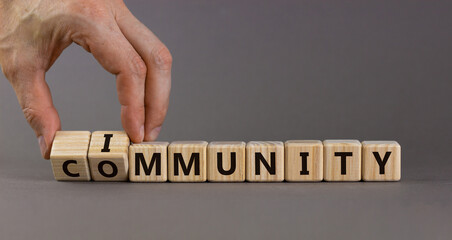 Community immunity symbol. Doctor turns cubes and changes the word 'community' to 'immunity'. Beautiful grey background, copy space. Business, medical and community immunity covid-19 concept.