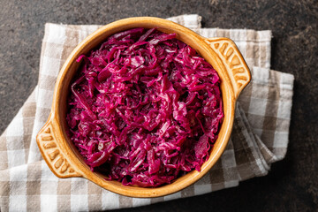 Red sauerkraut. Sour pickled cabbage in bowl.