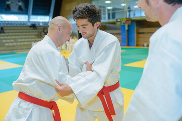 portrait of men practicing judo