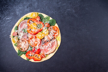Banner Pizza with cheese, tomatoes, bacon, pepper, spinach. On a blue background. Horizontal orientation.