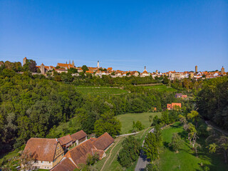 Fototapeta na wymiar Above the roofs of Rothenburg ob der Tauber on a sunny summer day