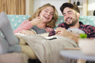 happy couple is relaxing and playing together the living room