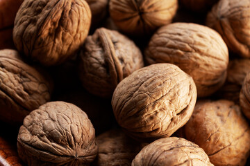 heap of walnuts in the foreground