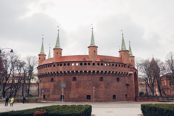 Fototapeta na wymiar Barbikan gate in Krakow city, Poland. Barbakan museum. Krakow places of interest