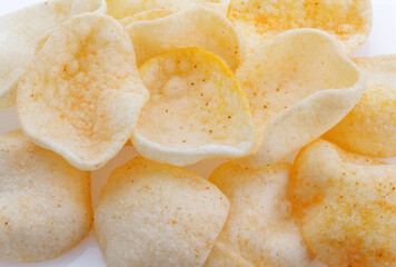 Fototapeta na wymiar Potatoes snack with pepper on isolated white background. Closeup