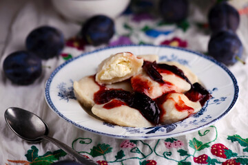 Vareniki with cherry in a ceramic bowl.