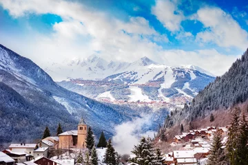 Gordijnen Panorama of Champagny-en-Vanoise village with mist and clouds around old church, over Courchevel resort on background © Sergey Novikov